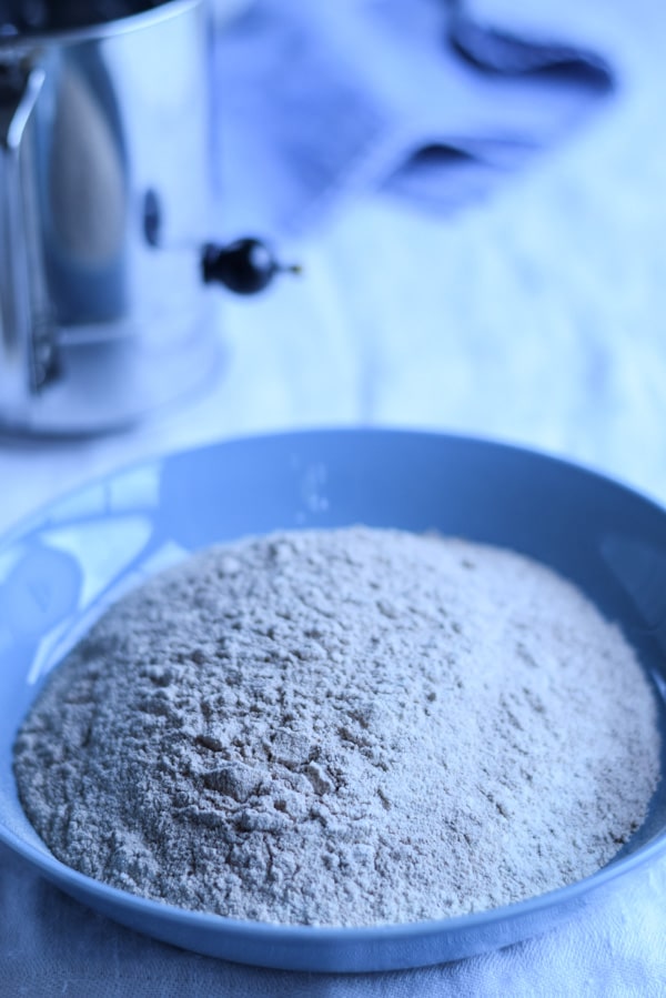 Flour and a sifter in the background
