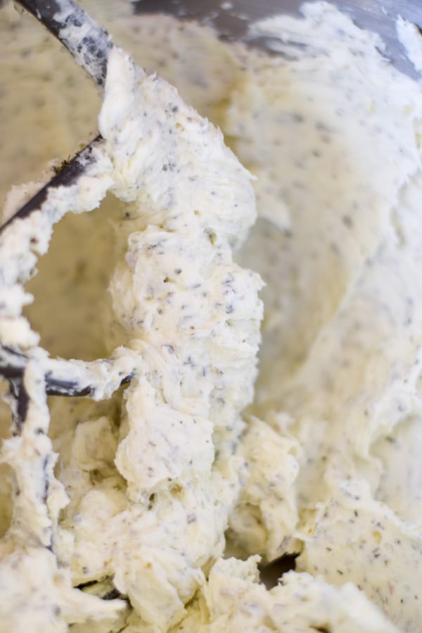 The spread in a metal mixing bowl with a paddle beater