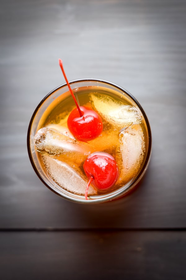 Overhead view of a manhattan with two red cherries in it
