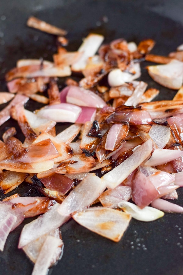 Onions saut&eacute;ed in a cast iron pan