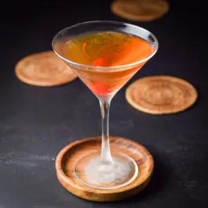 Rob Roy in a martini glass with a cherry in it