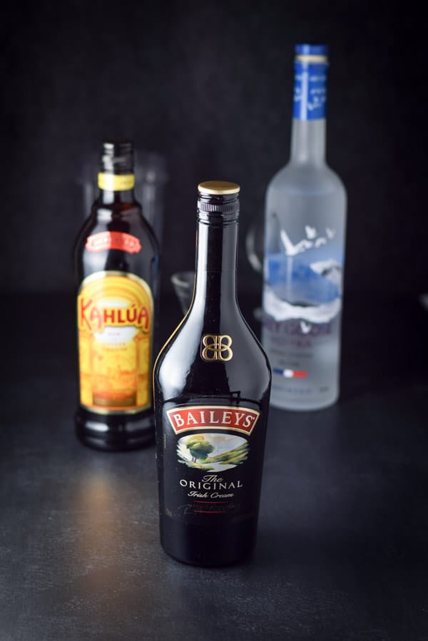 Irish cream, Kahlua and vodka with the shaker in the background