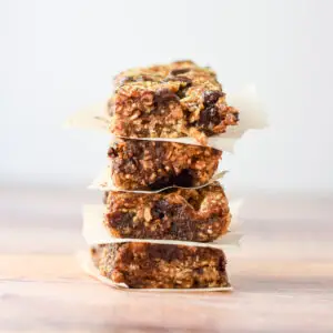 Vertical view of the granola bars stacked with paper between them - square
