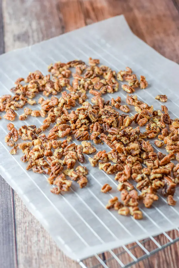 Pecans were added to the sugar mixture and laid on a parchment paper wire rack to cool