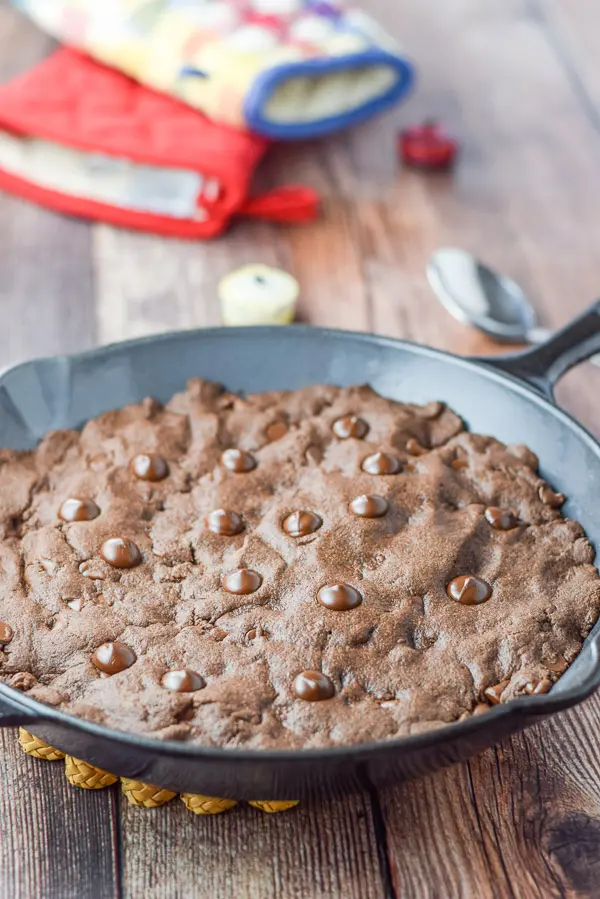 A skillet filled with a big brownie