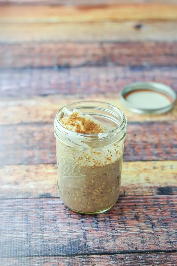 the oat mixture mixed with a spoon in the jar