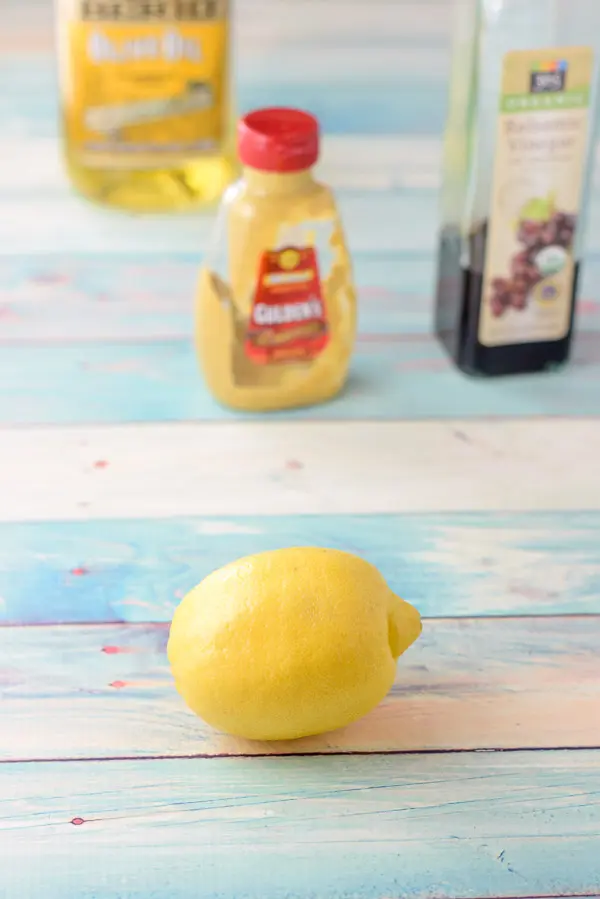 Dressing ingredients which includes lemon, mustard, vinegar and olive oil