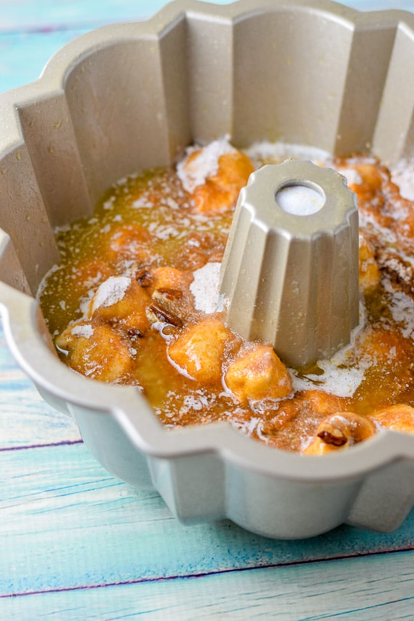 Melted butter poured on the dough in the bund pan