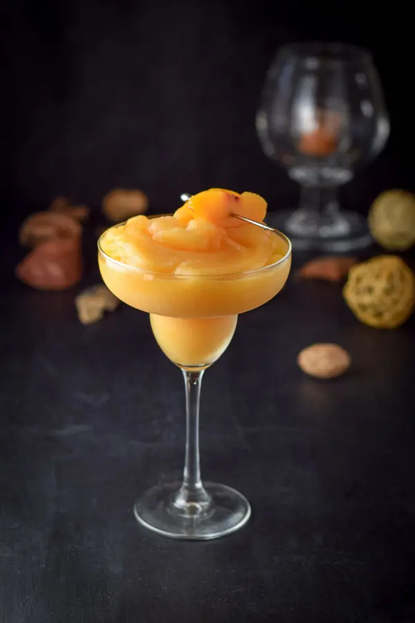 A peach frozen margarita blended and poured