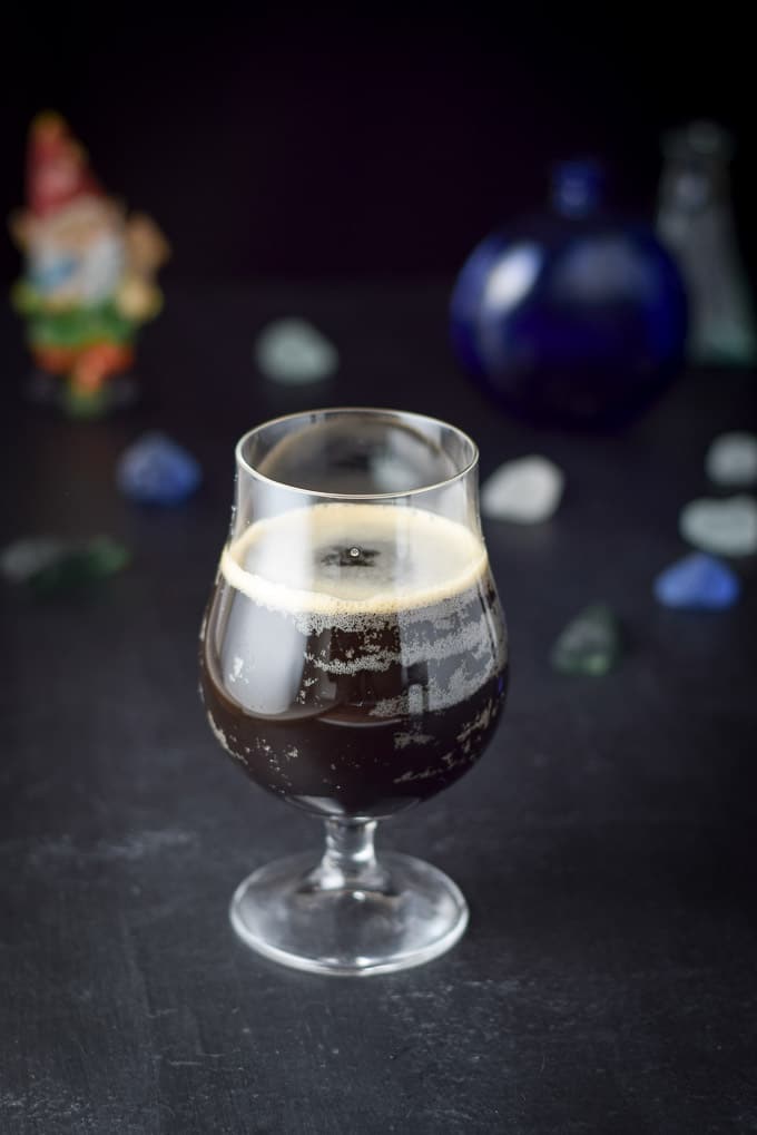 A curved beer glass filled with the Guinness cocktail