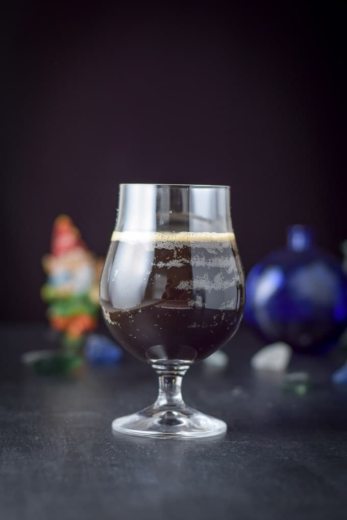 Vertical view of the stout cocktail with other objects in the background