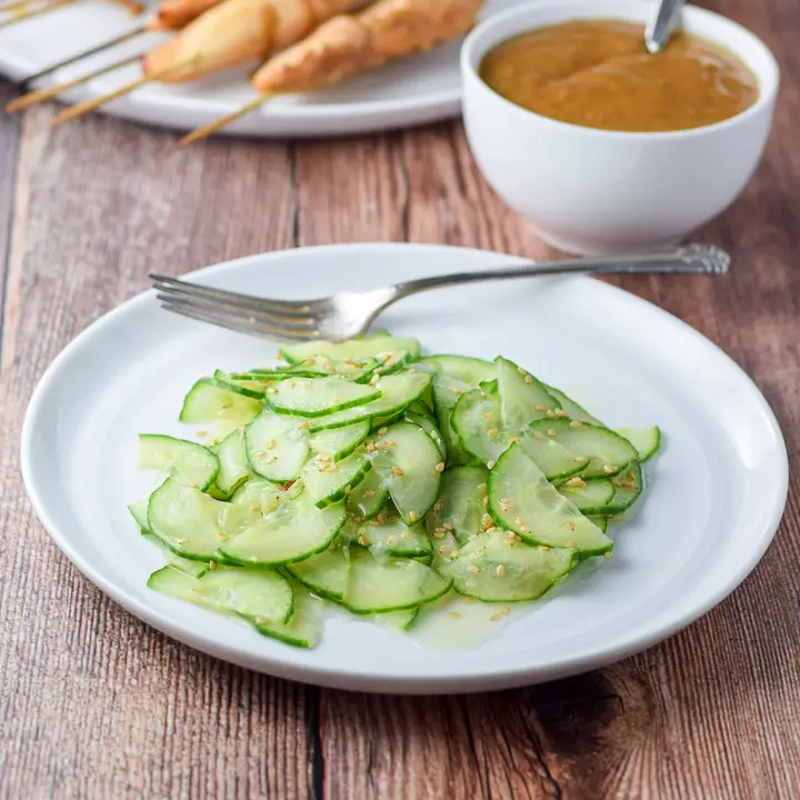 The cucumber with dressing served with chicken satay and peanut sauce - square