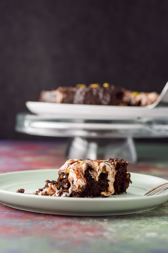 closer view of the marshmallow dripping cake with the cake in the background