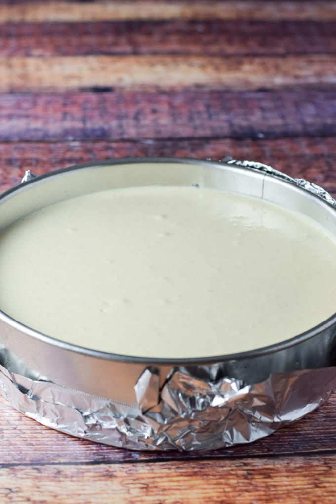 Cheesecake batter poured into the springform pan