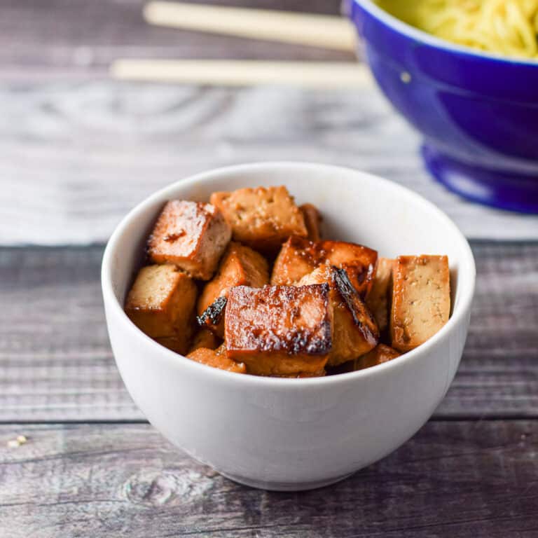 A bowl of tofu, another of noodles - square