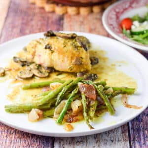 A plate with the vegetable and chicken on it - square