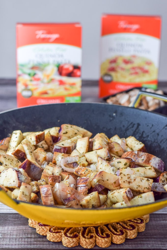 Saut&eacute;ed shallots and eggplant in a wok in front of some mushrooms and gluten-free pasta