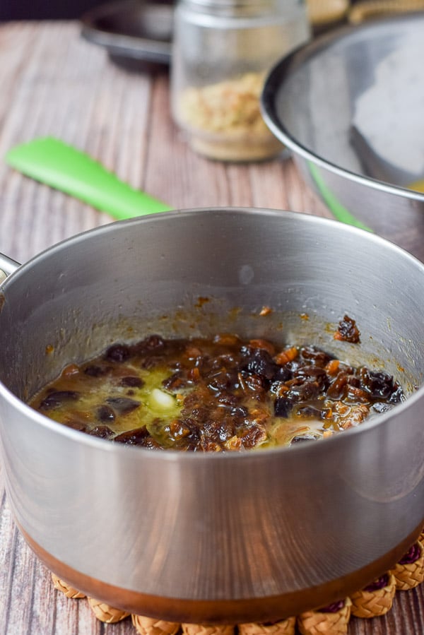 Cooked dates, prunes, raisins and butter in a pan