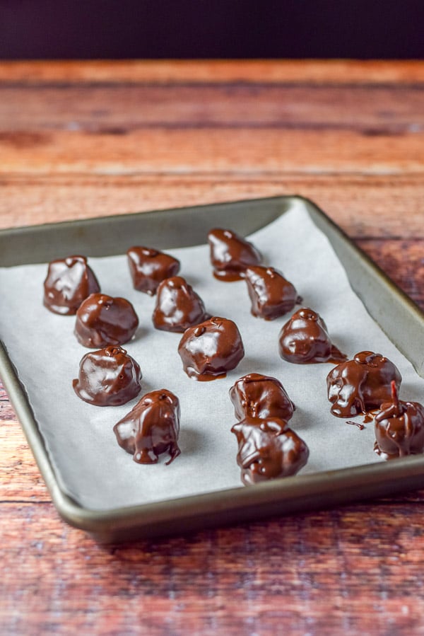 Small jelly roll pan with the coconut candies, covered in chocolate