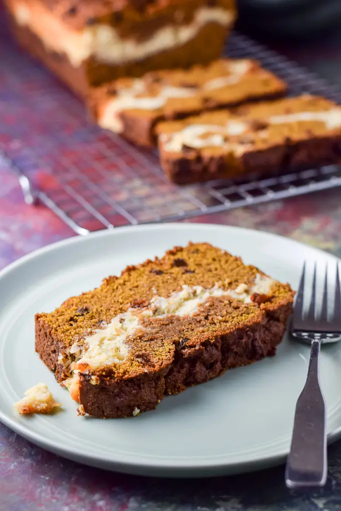 Close up of the pumpkin bread and a fork on the plate