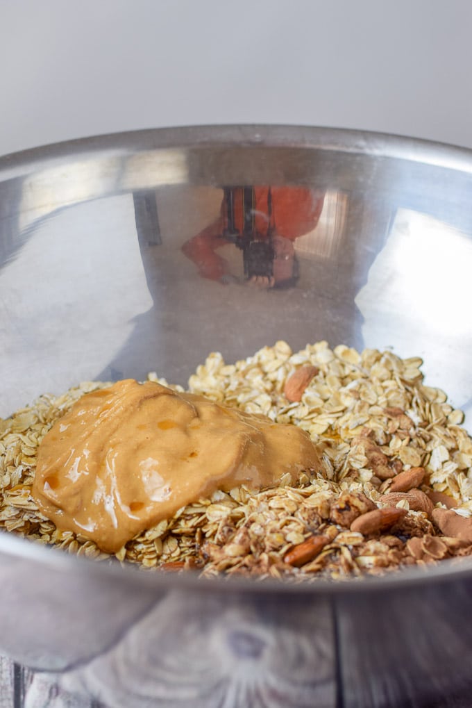 All the granola ingredients in the mixing bowl