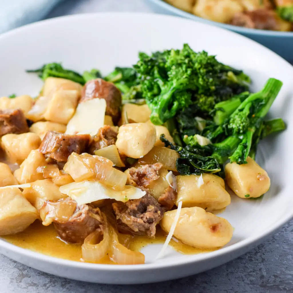 Gnocchi on a deep dish with broccoli rabe - square