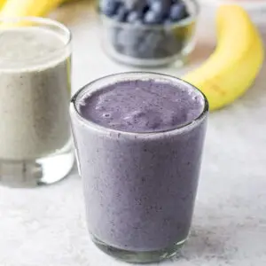 Glasses filled with blue and green smoothies - square