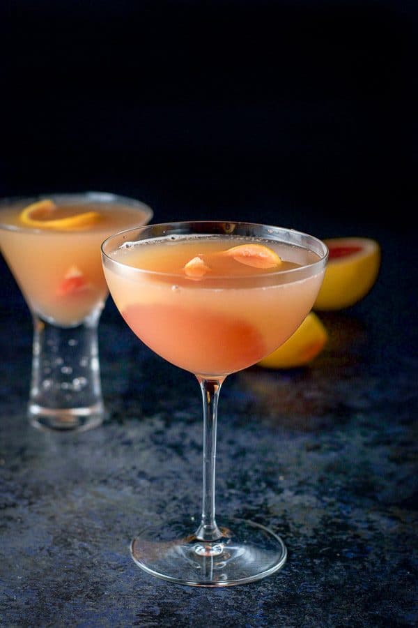 Ruby red grapefruit cosmo poured into two martini glasses