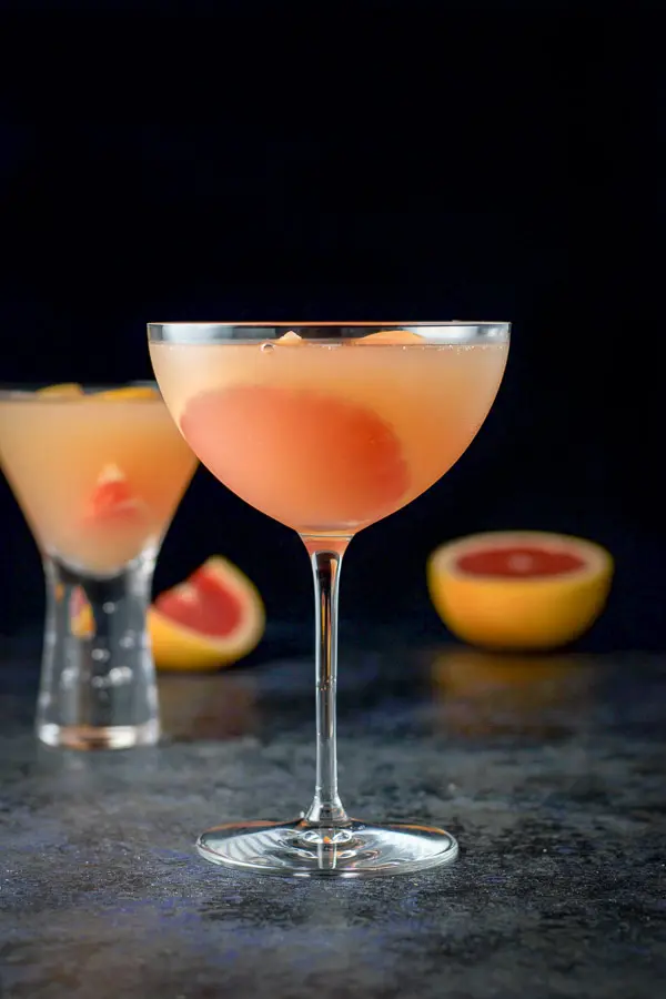 Vertical view of the cosmos with some sliced grapefruit in the background