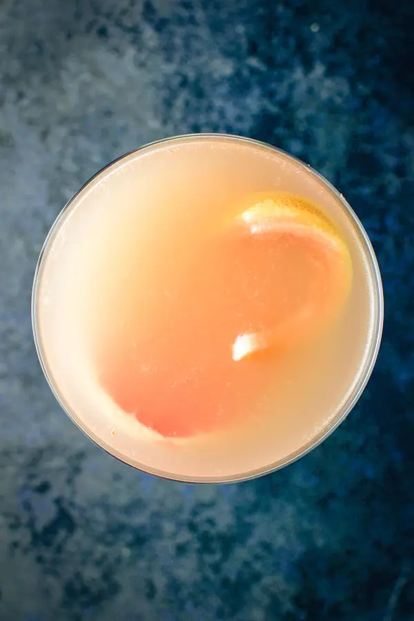 Overhead view of the ruby cosmo with a thin slice of grapefruit floating in the glass