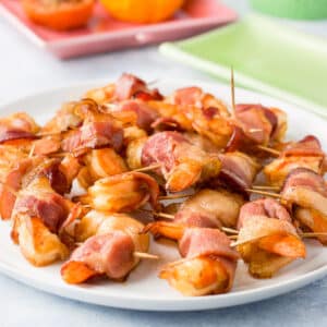 A white plate with the shrimp appetizer on it - square