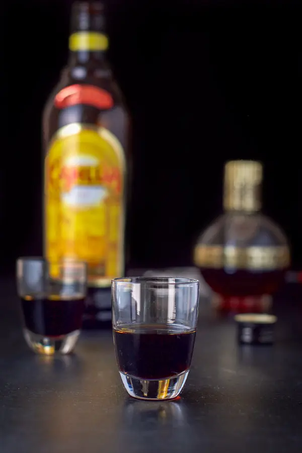 Kahlúa poured in the glasses with the bottle in the background