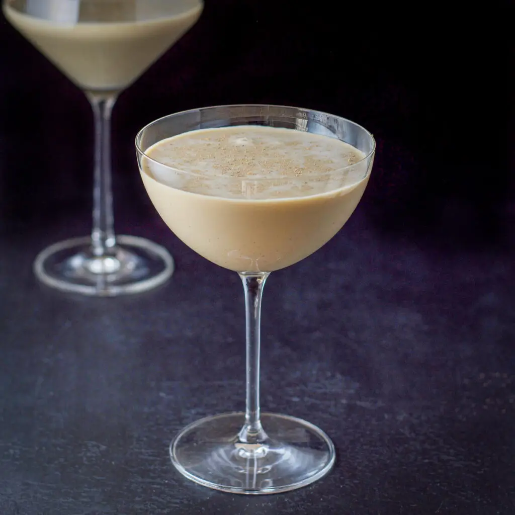A eggnog martini in a curved glass - square