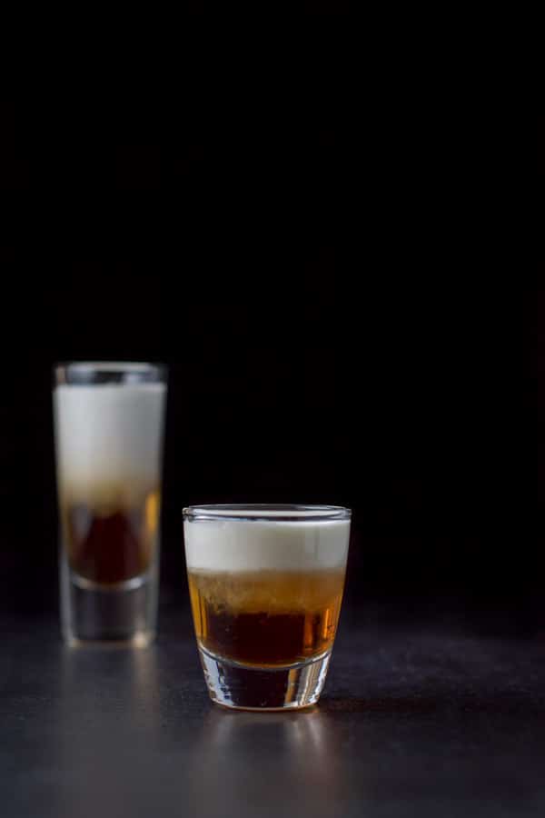Vertical view of the short glass filled with the three layered shot