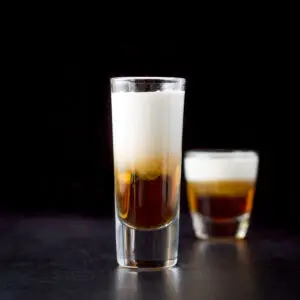 Two glasses filled with the three layered shot - square