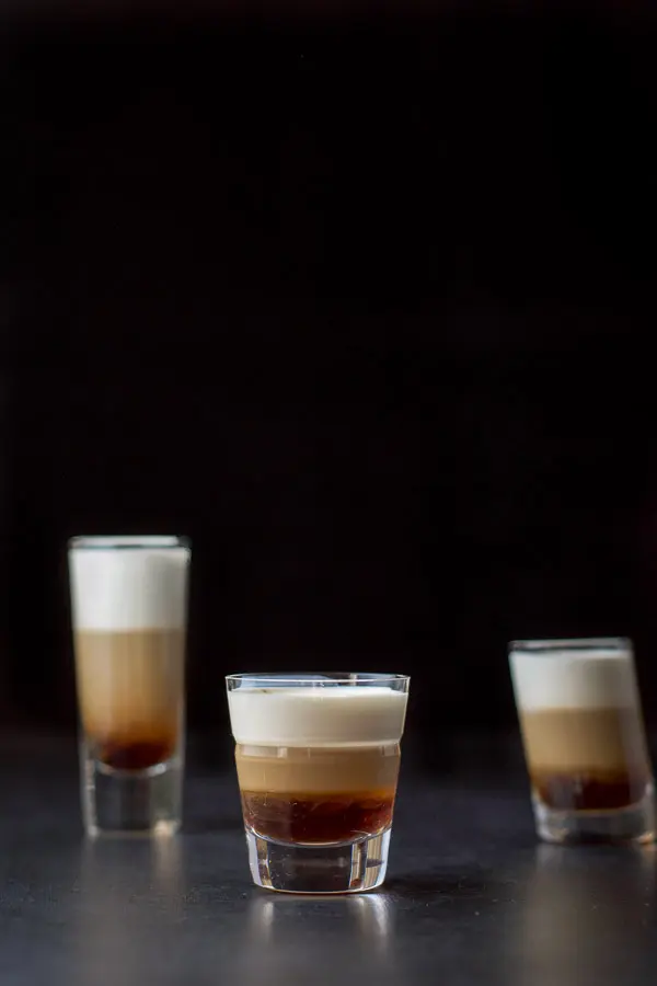 Vertical view of the three glasses filled with the shot