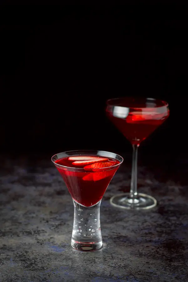 Another view of the red martini with the bubble martini glass in front and larger glass in back