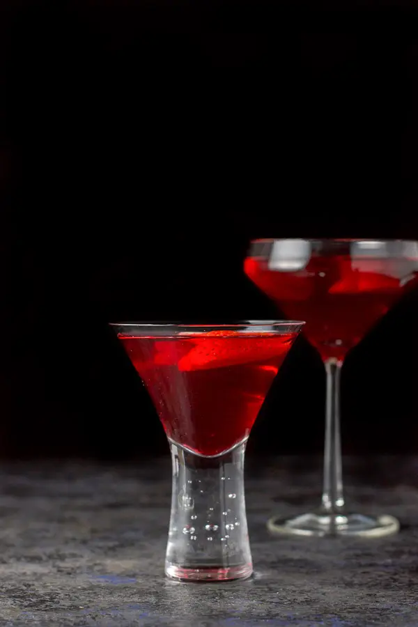 A vertical view of the red martini, short glass in front