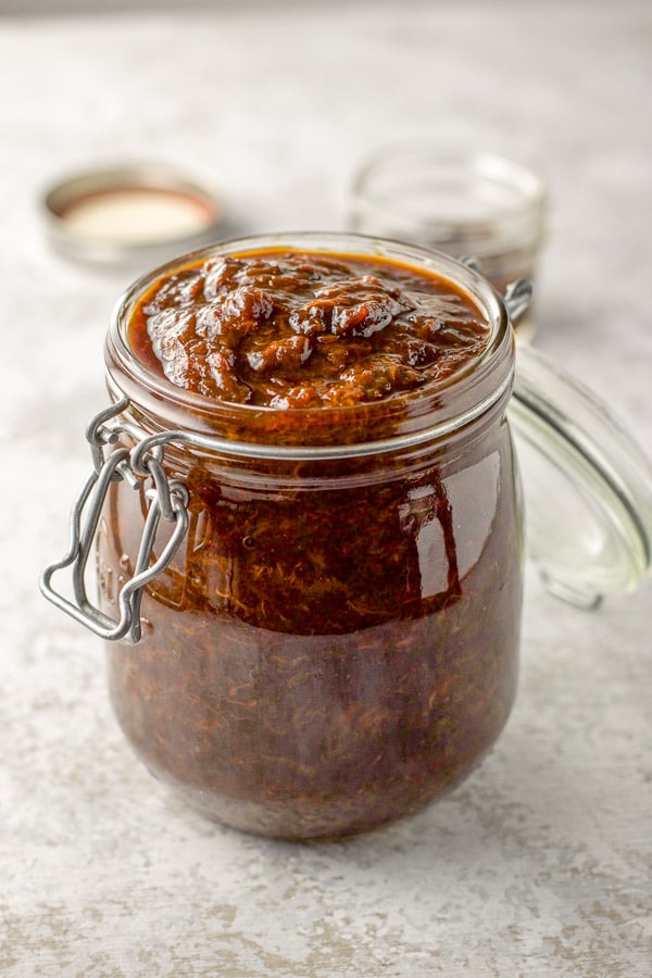 Prune spread in a large jar and a smaller jar in the background