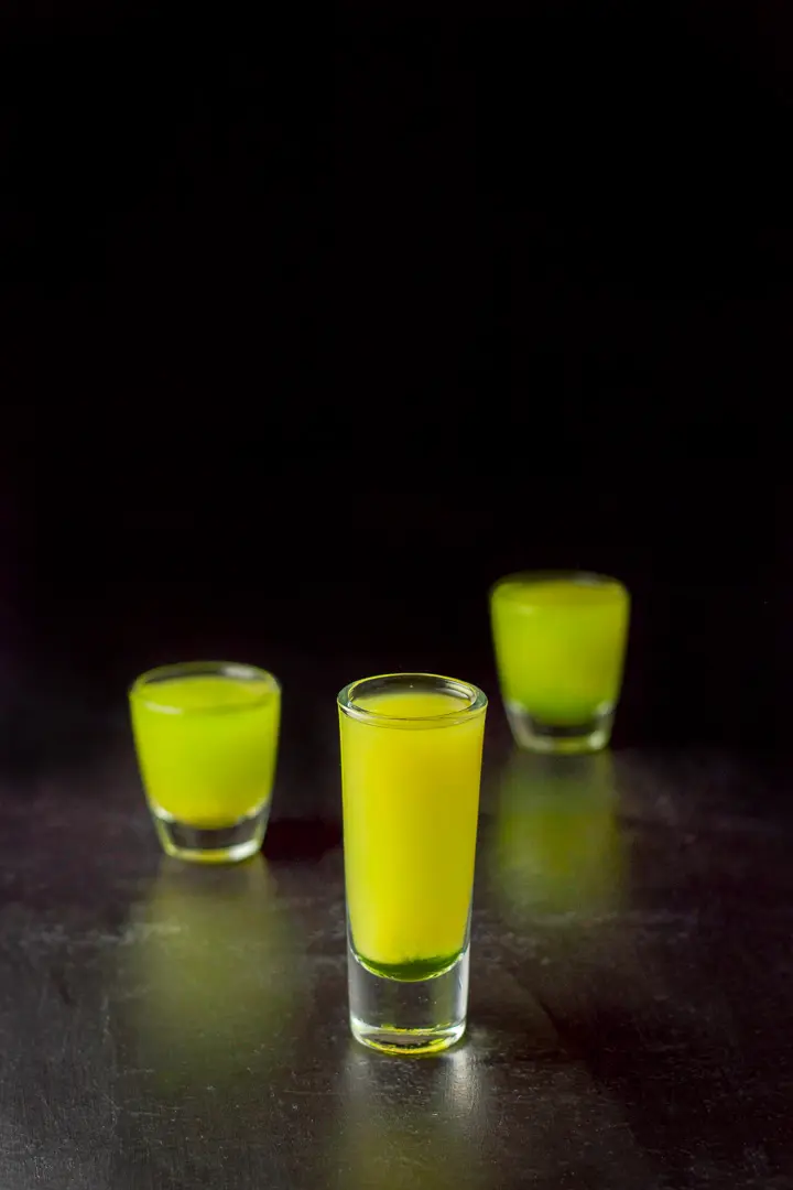 Orange juice layered into the three glasses