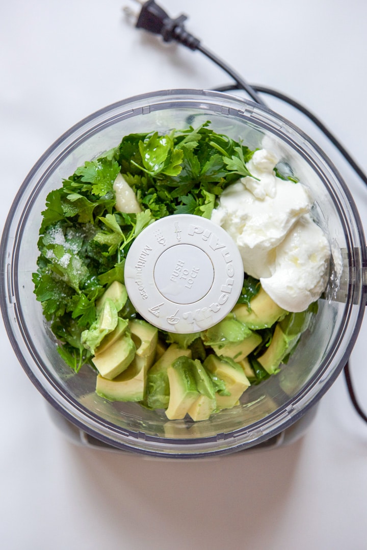 Food processor filled with all the ingredients for the spread