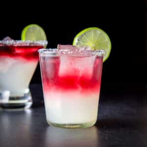 Double old fashioned glass filled with the layered margarita - square