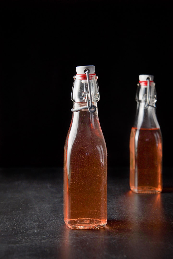 Two bottles of rhubarb vodka