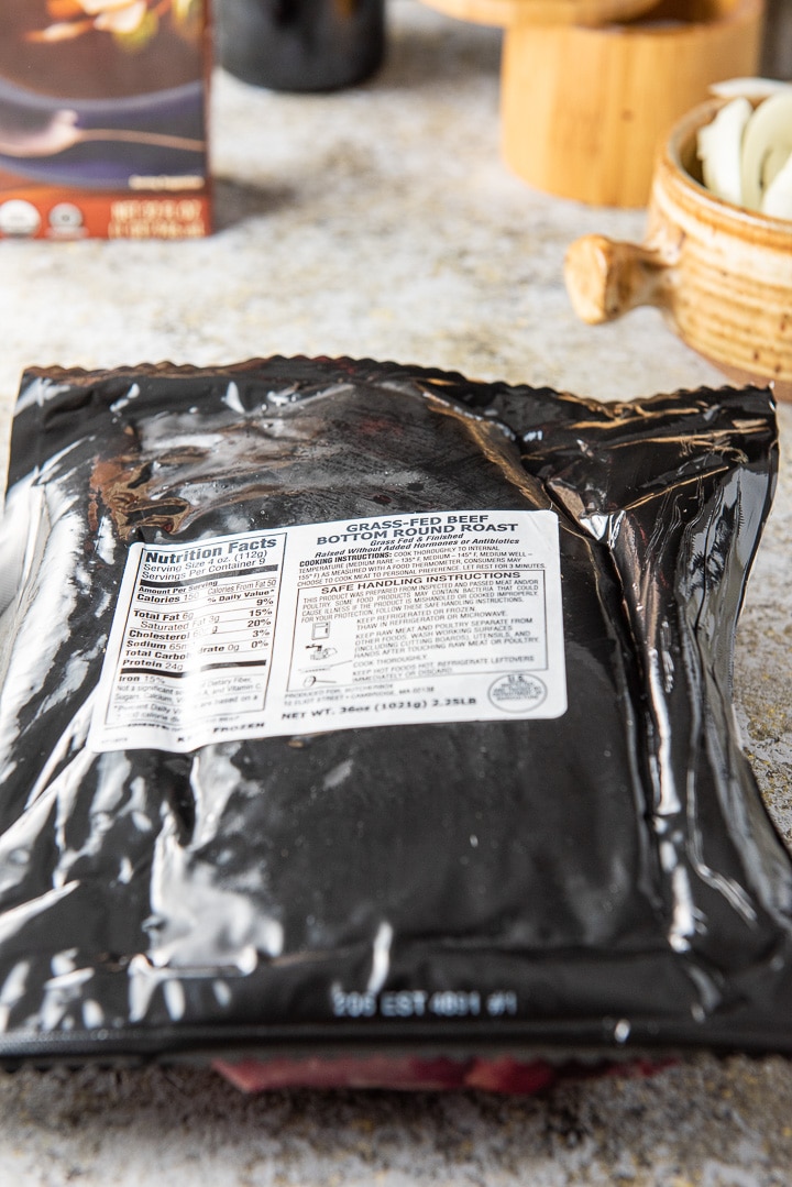 Grass-fed beef bottom round roast and other ingredients on the table