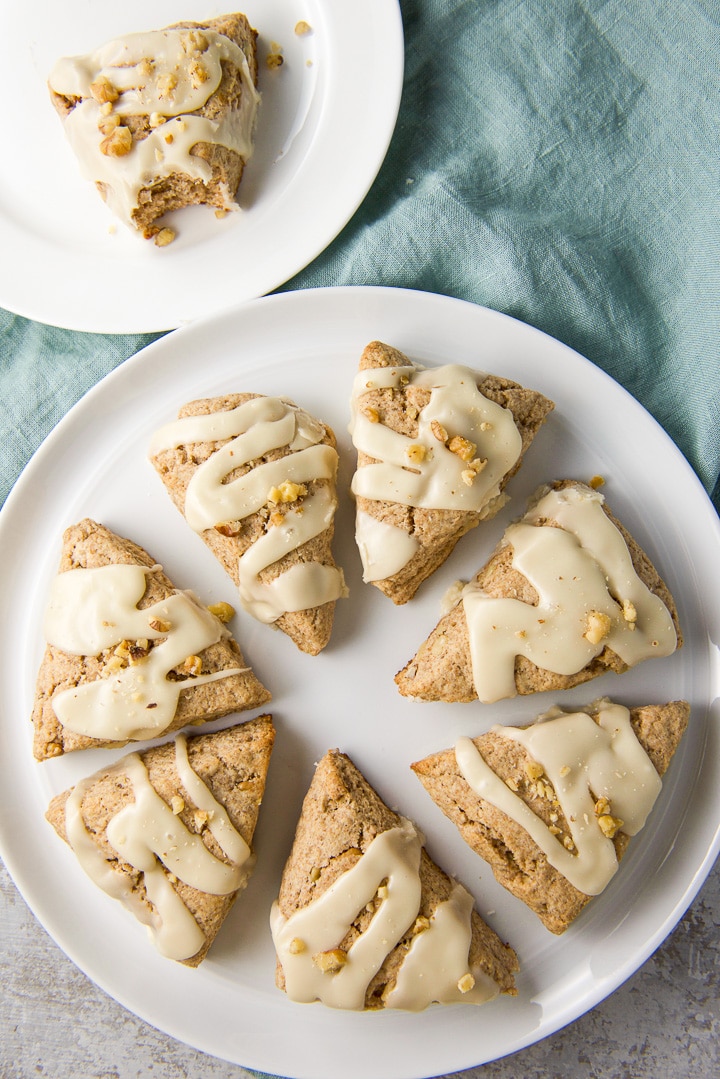 Overhead view of the scones on a big plate and a little plate in the corner with a bite taken out of the scone on it