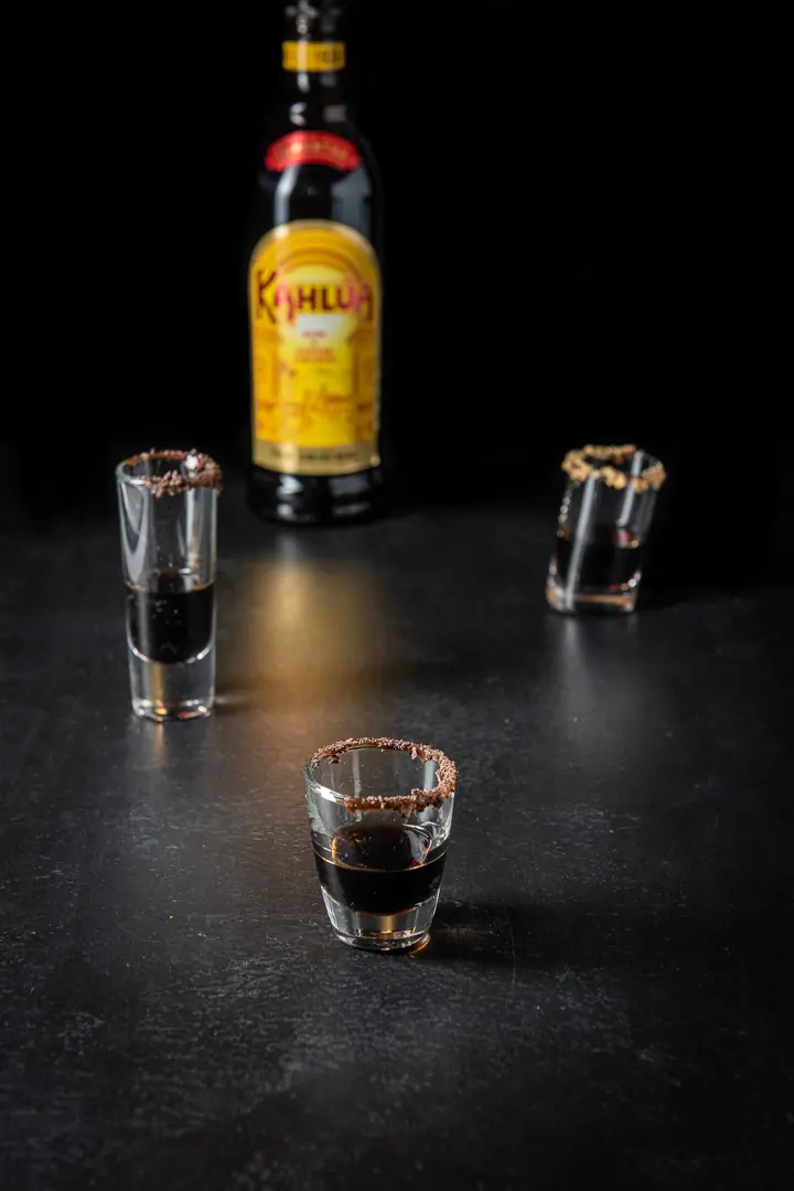 Coffee liqueur poured into the garnished glasses