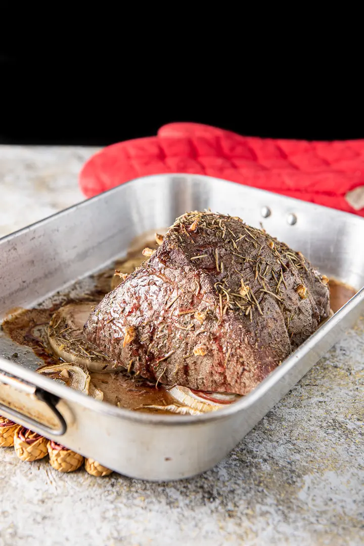 Roast beef straight out of the oven but still in the pan