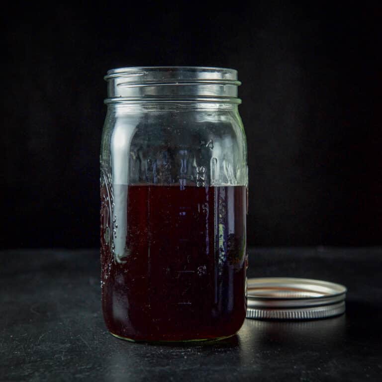 A jar of cherry infused bourbon - square