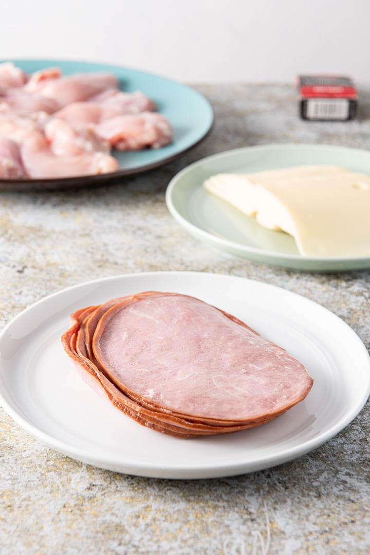 Ham, Swiss cheese and chicken on a blue plate