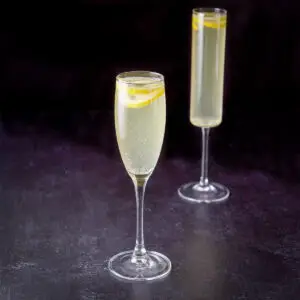 the classic champagne glass in front of the straight glass - square